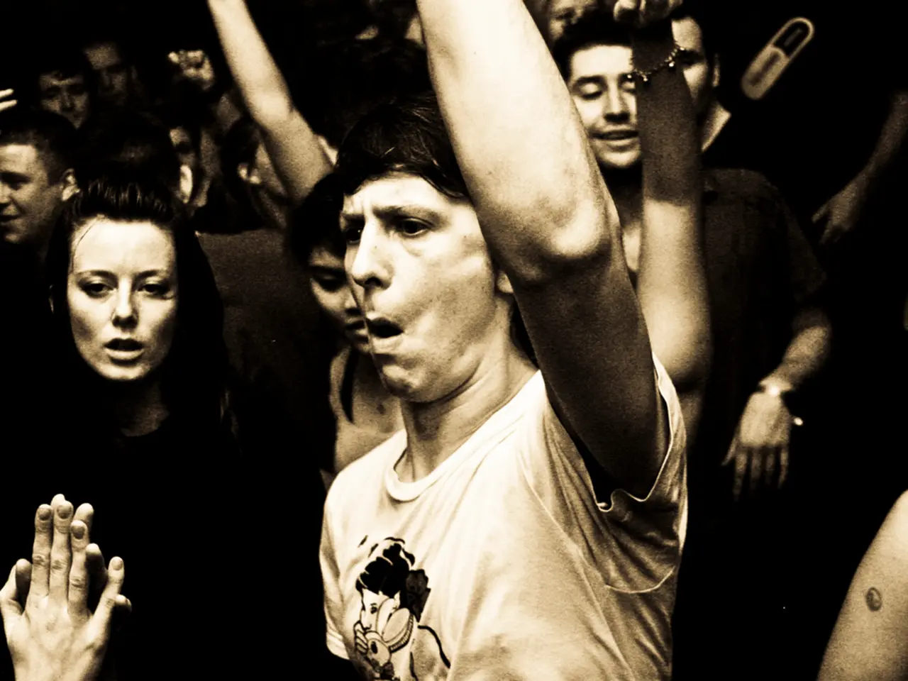 Here in this picture we can see number of people standing over a place and shouting something by...