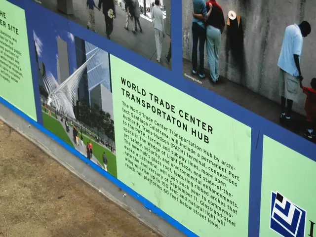 In this image I can see hoardings and a group of people are standing and walking on the floor and a...